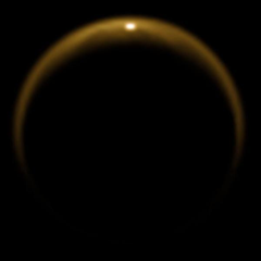 This image shows the first flash of sunlight reflected off a lake on Saturn's moon Titan. The glint off a mirror-like surface is known as a specular reflection. (Credit: NASA / JPL / University of Arizona / DLR)