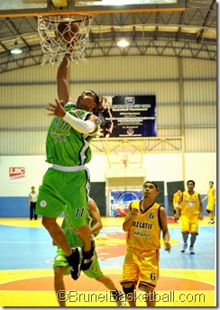 GV Leones (11) going for a lay-up while E. Ang (6) of Aziz Latiff looks on.
