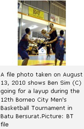 A file photo taken on August 13, 2010 shows Ben Sim (C) going for a layup during the 12th Borneo City Men's Basketball Tournament in Batu Bersurat.Picture: BT file 