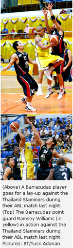 (Above) A Barracudas player goes for a lay-up against the Thailand Slammers during their ABL match last night. (Top) The Barracudas point guard Ramsey Williams (in yellow) in action against the Thailand Slammers during their ABL match last night. Pictures: BT/Yusri Adanan