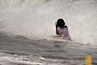 Huge Waves Engulfing the Swimmers at Saud's Pagudpud Beach