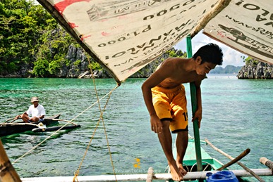 The Fee Collector Approaching our Boatman at Coron's Siete Pecados