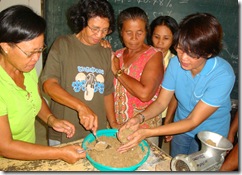Dr. Mae Catacutan (rightmost) demonstrates aquafeed formulation during the practical session