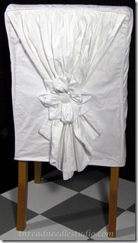 white drape slipcover back