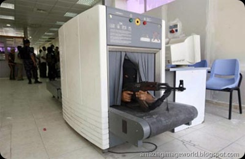 Hamas fighter takes position inside a scanning machine001