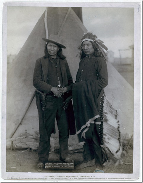 Title: "Red Cloud and American Horse." The two most noted chiefs now living
Two Oglala chiefs, American Horse (wearing western clothing and gun-in-holster) and Red Cloud (wearing headdress), full-length portrait, facing front, shaking hands in front of tipi--probably on or near Pine Ridge Reservation. 1891.
Repository: Library of Congress Prints and Photographs Division Washington, D.C. 20540