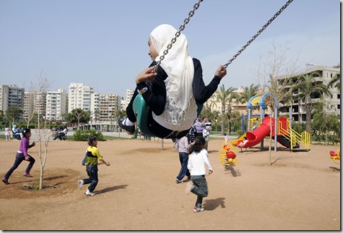 CHILDREN AND PARENTS PLAYING IN A PARK IN TRIPOLI, LEBANON
Photograph by Julio Etchart
www.julioetchart.com
