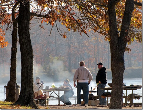 Grandpa, Son, and Grandsons enjoying autumn weekend breakfast and fishing at the lake