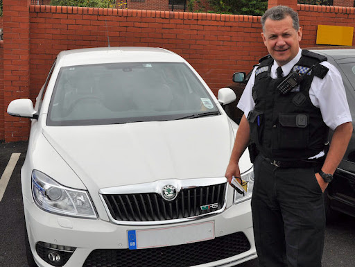 Policeman%20with%20car.jpg
