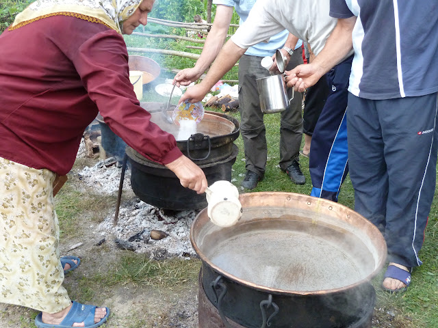 Villagers preparing tea for marchers  