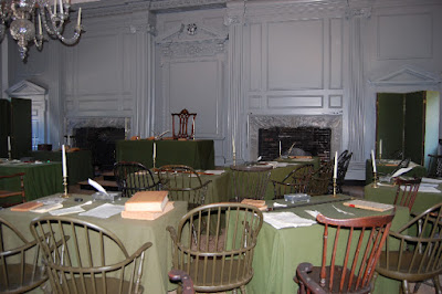 The chair in the back of this room in Independence Hall is the original where George Washington sat