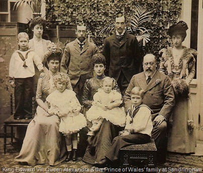 King Edward VII, Queen Alexandra and the Princess of Wales, later Queen Mary, are seated from right to left. The Prince of Wales, later King George V, is standing between his wife and mother.