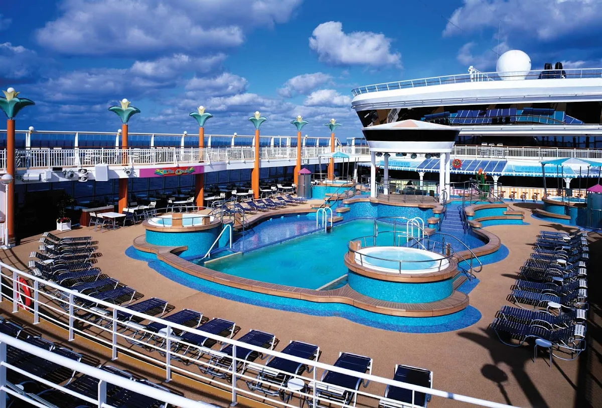 Norwegian-Dawn-Pool-Deck - Spend time on Norwegian Dawn's pool deck for a swim in the pool or a relaxing soak in the whirlpool.