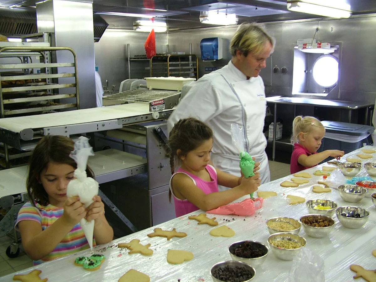 Junior-Cruisers-Kids-Baking-Cookies-in-the-Galley - Children can visit the Galley and take a turn baking with the Junior Cruisers on a Crystal cruise.