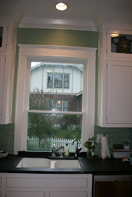 Sink in front of low window / banquette / old house - Kitchens