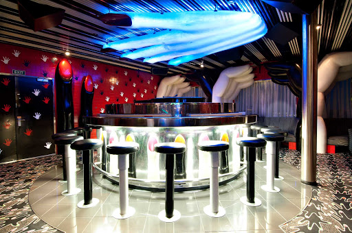Sing along to your favorite tunes at Touch of Class, a popular piano bar on Carnival Sensation.