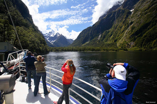 Camera_action_Milford_Sound - How much natural grandeur can you handle? You’ll find out at Milford Sound, where the scenery comes in just one size: extra large. Peaks rise straight out of the water and fairy tale waterfalls fill the air with mist.  