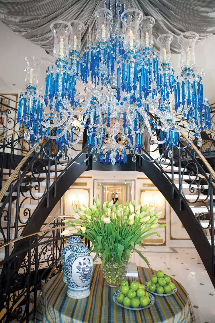 A magnificent crystal Baccarat chandelier greets guests in the foyer of the S.S. Antoinette cruise ship.