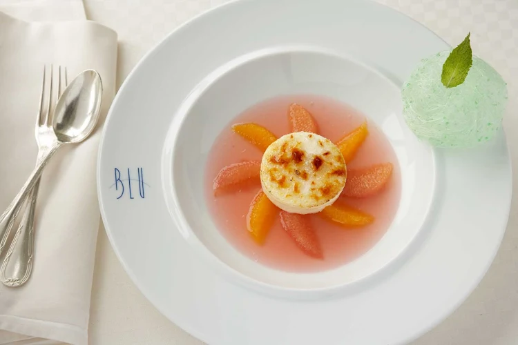The delicate citrus flavor of an Aspic dessert will complete your evening. You'll find it at Blu restaurant on your Celebrity cruise.
