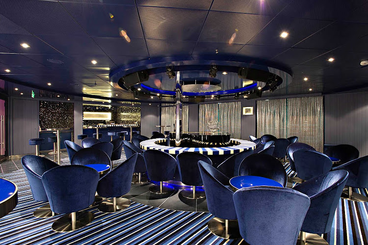 Relax with a cocktail and listen to pop favorites at Piano Bar 88 aboard Carnival Sunshine. 