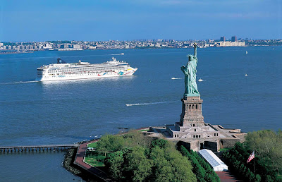 Norwegian Dawn cruising by the Statue of Liberty in New York.