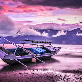 a fishing boat resting on the  mamboro beach by Dedik Dwi Nugroho - Transportation Boats