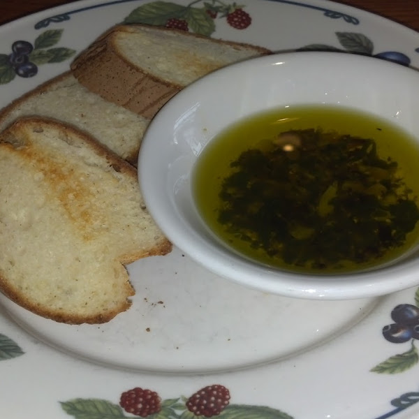 Lightly toasted GF french bread with olive oil dip.
