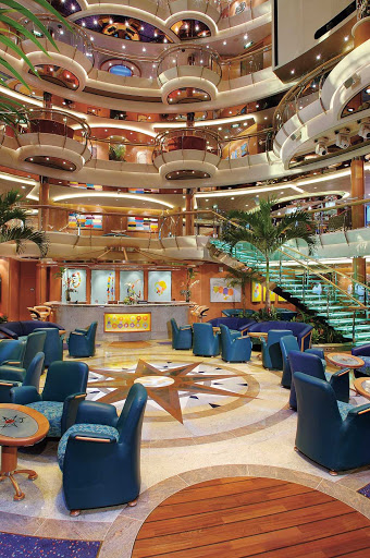Jewel-of-the-Seas-Centrum - The Centrum aboard Jewel of the Seas, nine decks high, is adorned with fine décor, glass-sided elevators and stairs with a comfy lobby area.