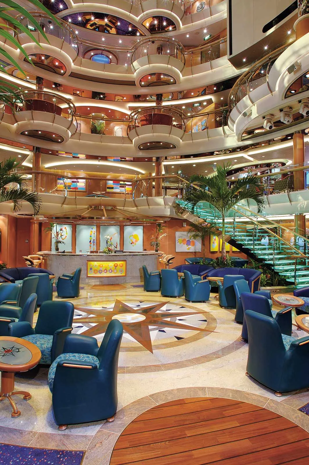 Jewel-of-the-Seas-Centrum - The Centrum aboard Jewel of the Seas, nine decks high, is adorned with fine décor, glass-sided elevators and stairs with a comfy lobby area.