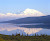 The magnitude of the snow-capped peaks reflect in this lake in Denali National Park, Alaska.