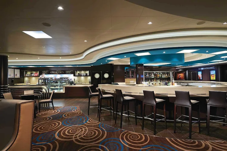 Have a grand time dining or drinking while taking in views of three decks from the Atrium Cafe & Bar aboard Norwegian Getaway.