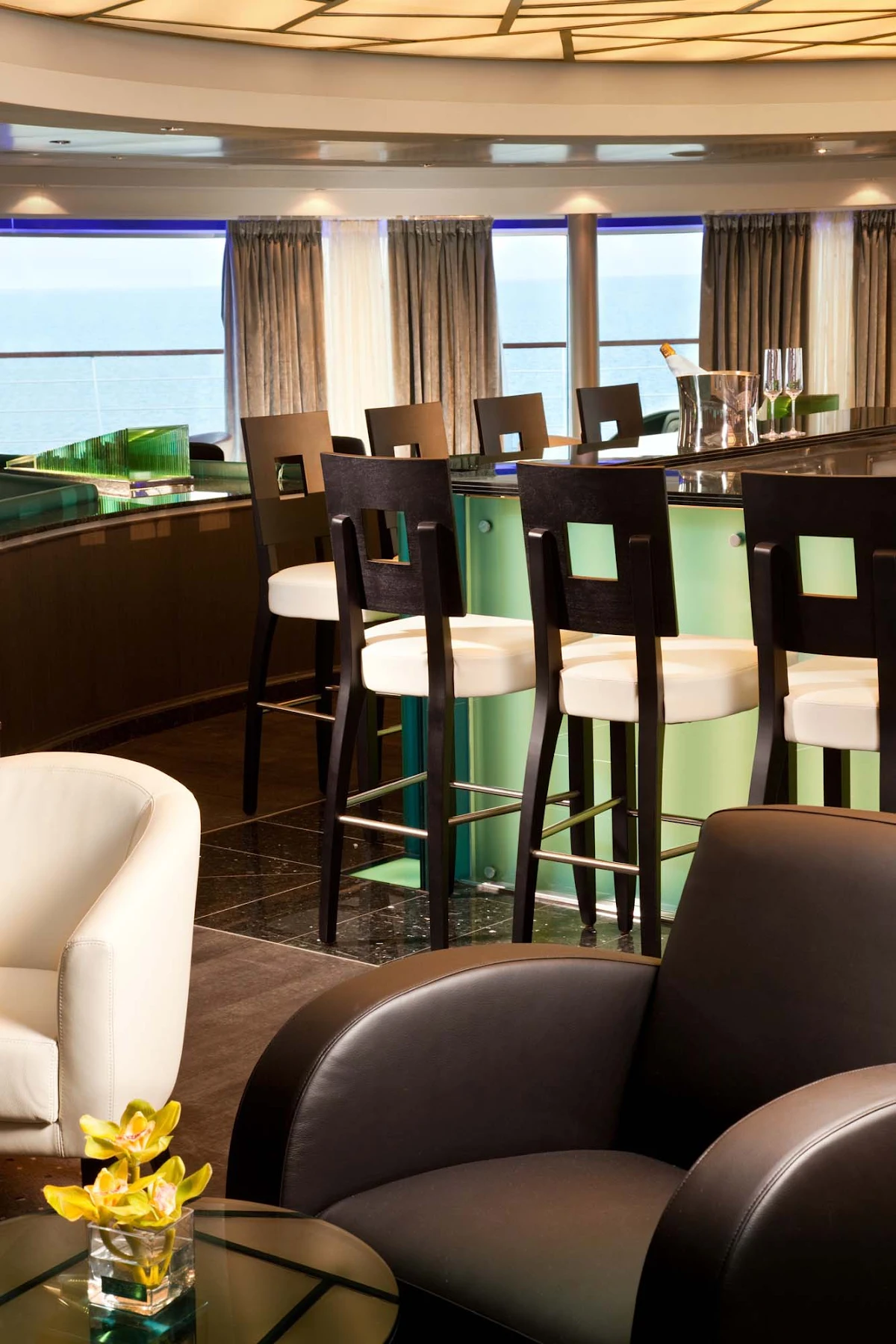 Seabourn_Observation_Bar - Panoramic views greet guests as they gather for early morning risers' coffee and tea in the Observation Bar on Seabourn Quest.