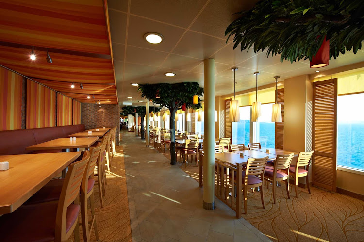 Get up-close views of seascapes during meals in the Lido Dining room aboard Carnival Breeze.