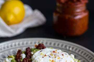 Harissa, Smashed Avocado + Egg Toast with Goat Cheese and Honey Drizzle.