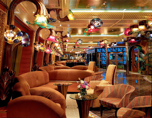Carnival-Conquest-Impressionist-Boulevard - There's plenty of seating along Impressionist Boulevard, Carnival Conquest's indoor promenade, to meet friends or take in the ocean views.
