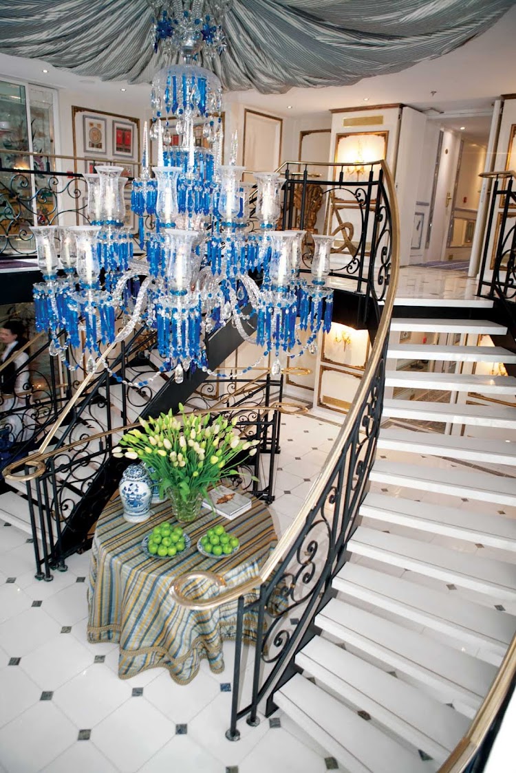 S.S. Antoinette's elegant lobby is lit up by a stunning crystal Baccarat chandelier.