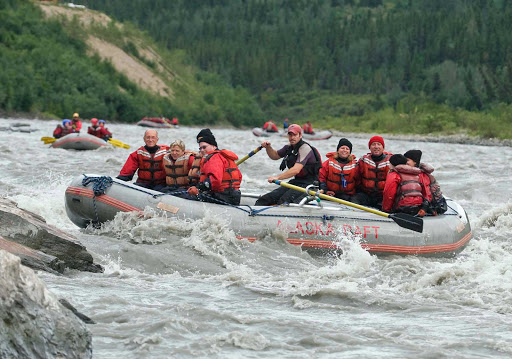 Guides lead groups of visitors through white water in Denali National Park, Alaska.