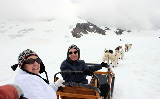 sled-dogs - Mush! Here's me and mom actually taking a dog sled ride.. on a glacier!