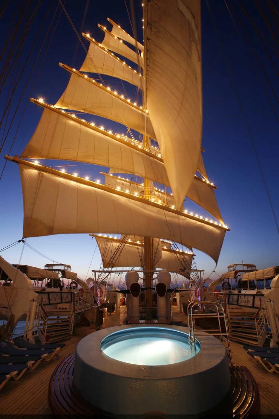 Royal-Clipper-sails-at-night - Relax in Royal Clipper's deluxe whirlpool at night when the ship is lit up.