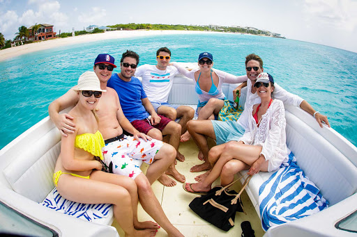 A group of water enthusiasts enjoys an outing on a pleasure craft in Anguilla.