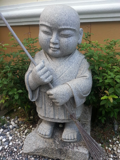Monk with Broom Statue