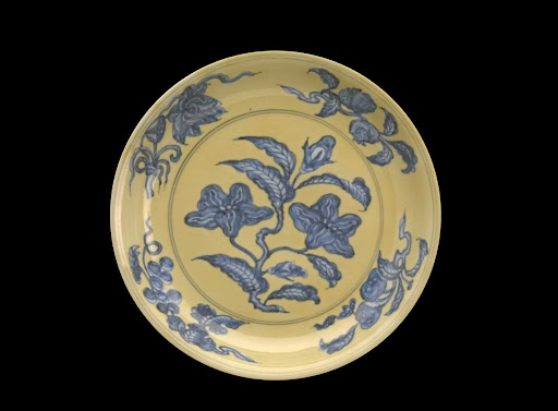 yellow dish with blue flowers