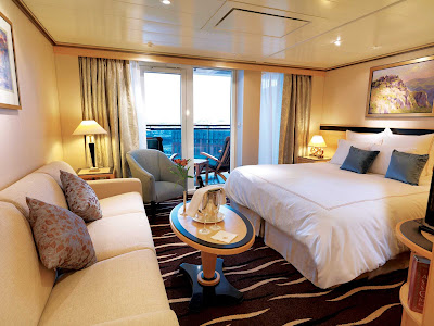 The Princess Suite aboard Queen Mary 2 offers guests a spacious private balcony, king bed, sitting area and more.