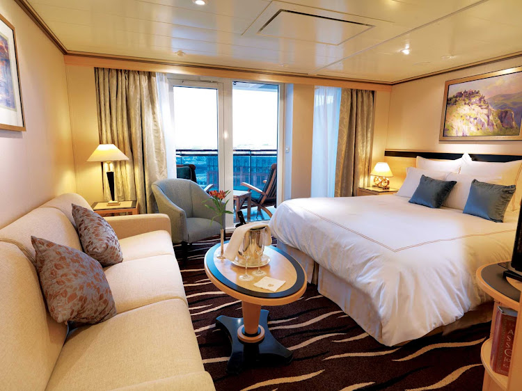 The Princess Suite aboard Queen Mary 2 offers guests a spacious private balcony, king bed, sitting area and more.