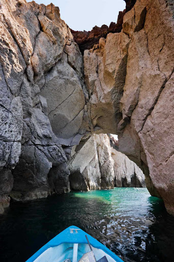 Boats can float beneath the rock arches near Cabo San Lucas.