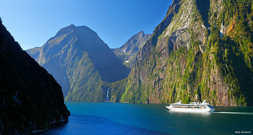 Milford_Sound_waterfalls - Carved by glaciers during a series of ice ages, Milford Sound is a world of waterfalls. Some of them tumble more than 1,000 metres before they splash into the ocean. Others never even reach the sea – they simply drift away in the wind. When it rains here, the number of waterfalls explodes – they’re simply everywhere.