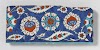 Tile with floral scrolls