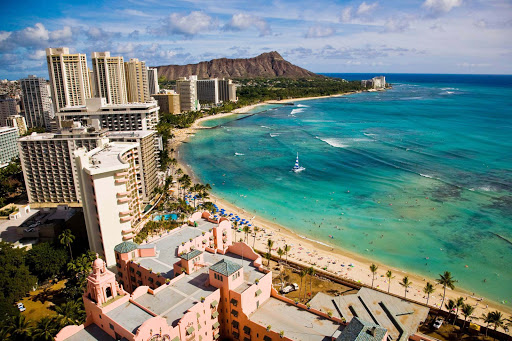 Waikiki-Beach-panorama - A wide shot of Waikiki Beach in Honolulu with Diamond Head in the distance.