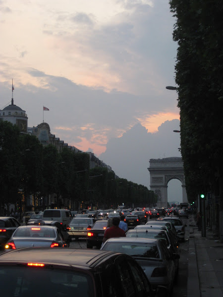 L’Arc de Triomphe at the end of a crowded <span>Champs-Elysees.</span>