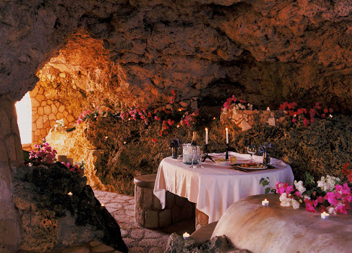 The-Caves-Negril-Jamaica - For a memorable dinner, dine at the Caves, an upscale oceanfront gazebo in Negril, Jamaica, with a hand-crafted stone table lit by candlelight. It's owned by Island Records founder Chris Blackwell, who made Bob Marley a star.